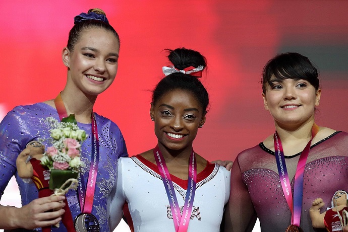 Simone Biles, in centre 