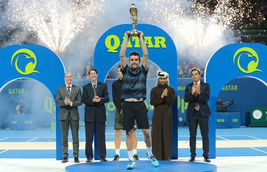 Roberto Bautista Agut holds the Qatar ExxonMobil Open trophy at the Khalifa International Tennis Complex on Sunday. Photo: QOC