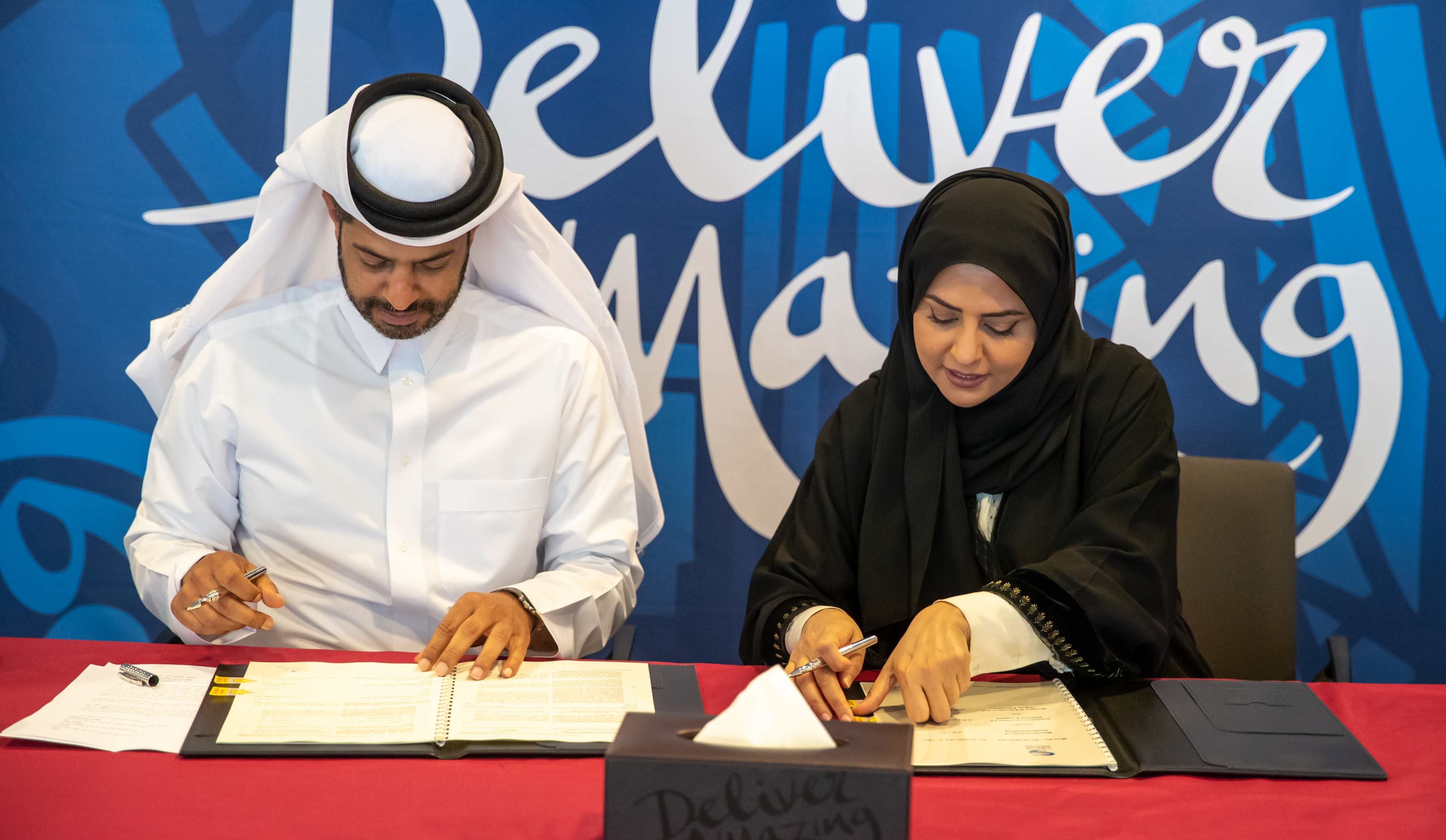 Nasser Al Khater, CEO, FIFA World Cup Qatar 2022™, and Fawziya Al Khater, Assistant Undersecretary for Educational Affairs at the Ministry of Education and Higher Education sign the MoU