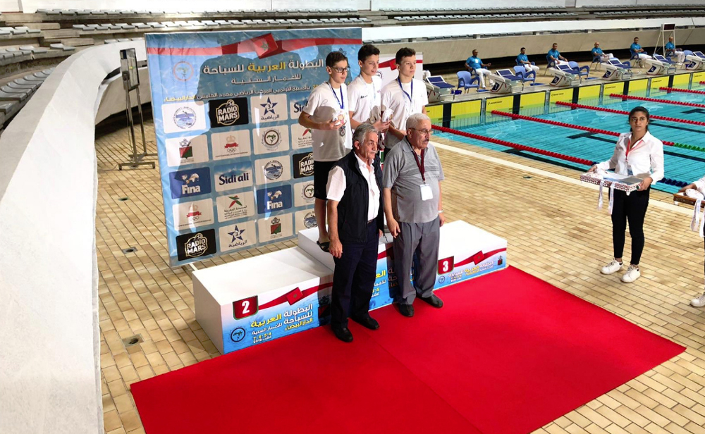 Qatar's Tamim Mohammed stands on Medal Poduim