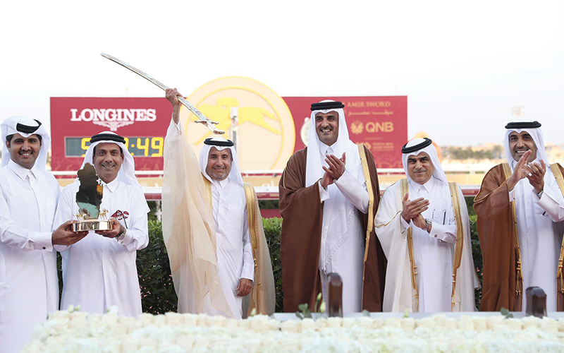 His Highness the Amir Sheikh Tamim bin Hamad al-Thani applauds the winners of His Highness The Amir Sword race 