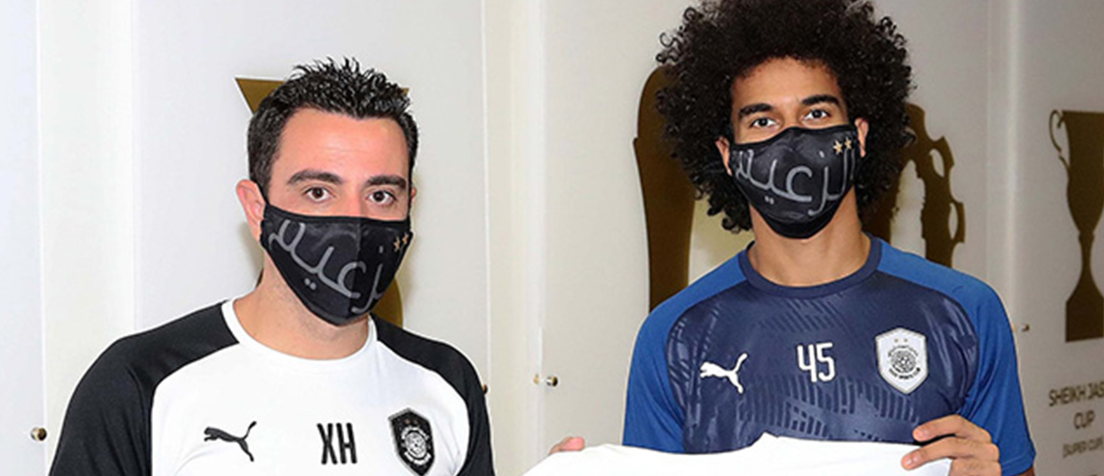 Al Sadd forward Akram Afif and Xavi after signing new contract 