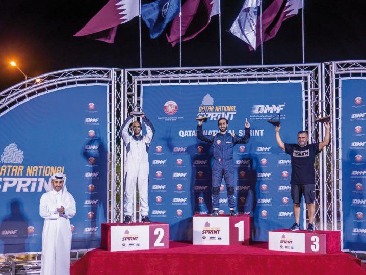 Abdullah Al Khelaifi celebrates on the podium