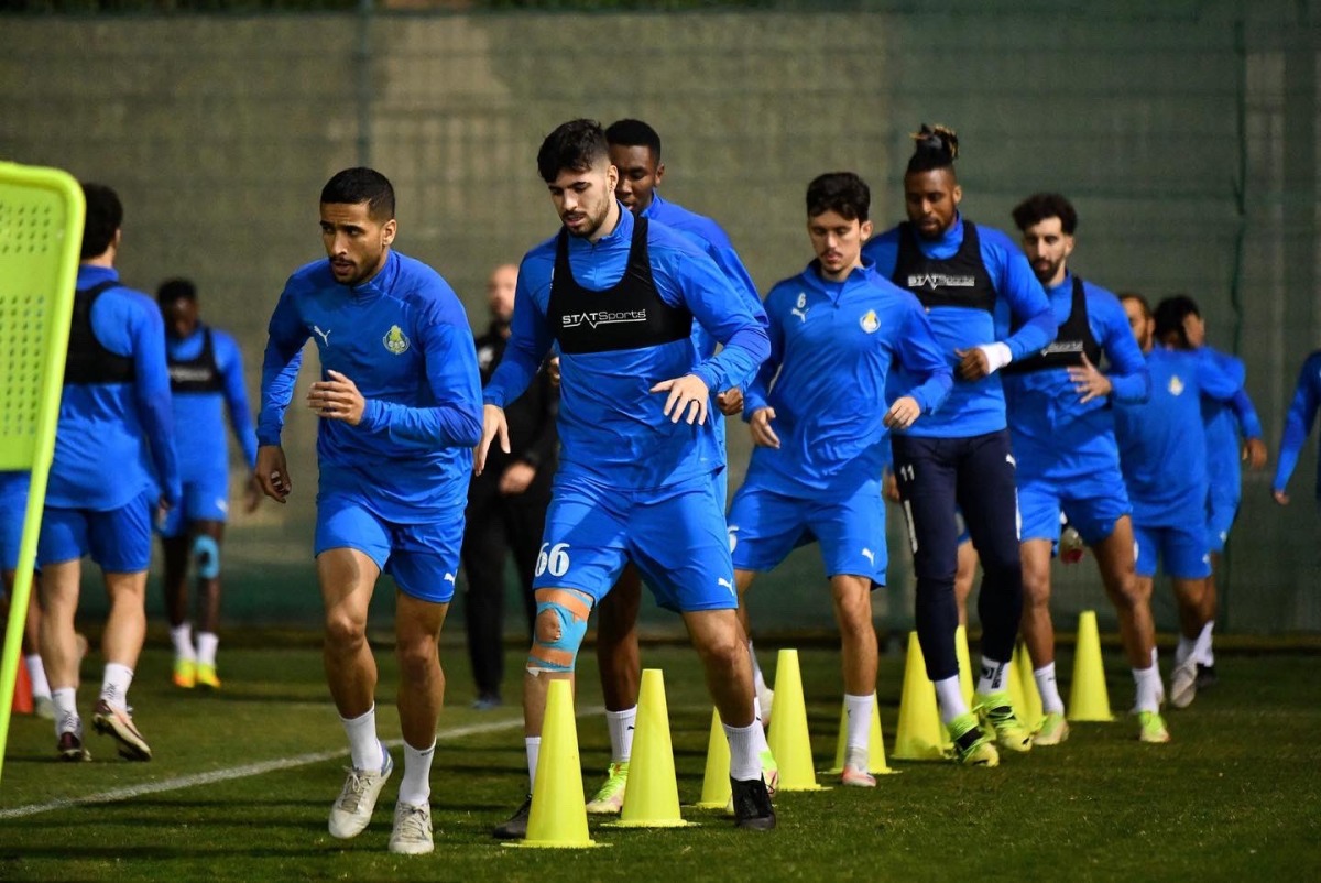 Al Gharafa players in action during a training session, yesterday.