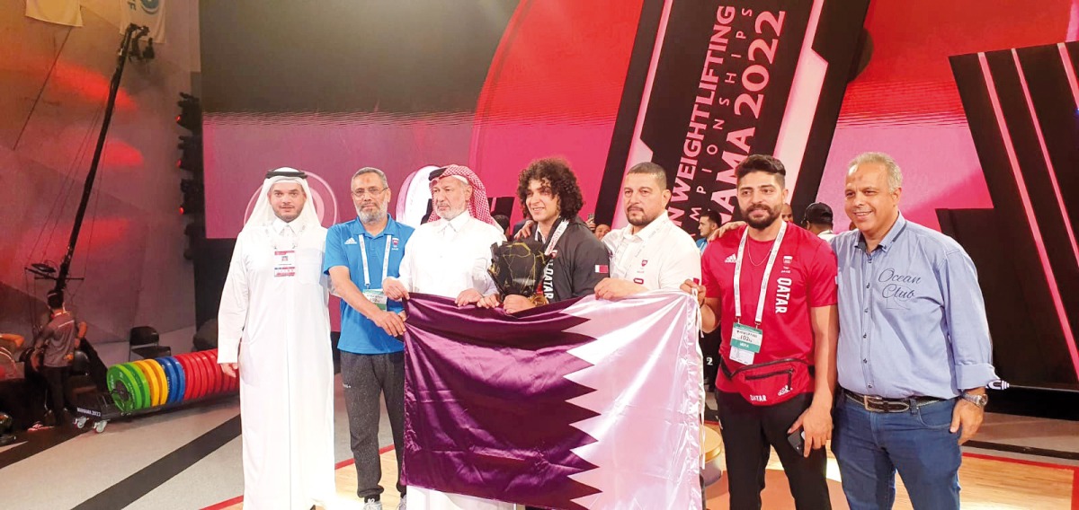 Qatar's Fares Ibrahim celebrates with officials